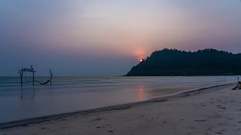 Timelapse of moving clouds at sunset above white sand beach at Koh Kood Stock Footage 272614584