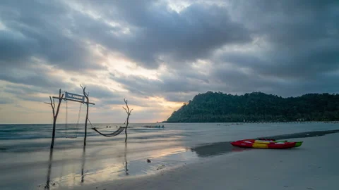 Timelapse of moving clouds at sunset above white sand beach at Koh Kood Stock Footage 272614636