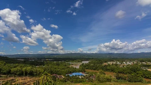 Timelapse of moving dramatic cloud with clear blue sky over the beautiful rural Stock Footage 117603691