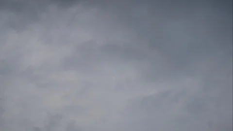 Timelapse moving rain cloud with blue sky background at day time Stock Footage 129929693