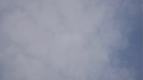 Timelapse moving rain cloud with blue sky background at day time Stock Footage 129929698