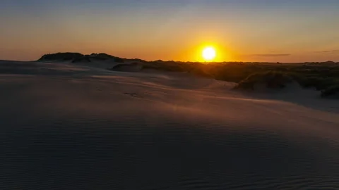 Timelapse of moving sand dunes in the Danish desert at sunset Stock Footage 166316819