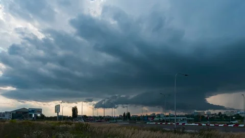 Timelapse of a moving supercell thunderstorm over the city Stock Footage 301436513