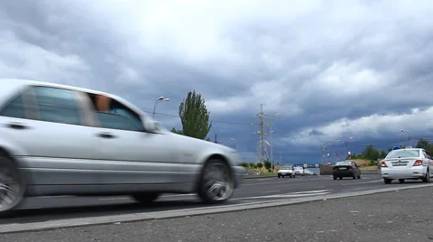 Timelapse moving vehicles on a background of blue clouds Stock Footage 65990189