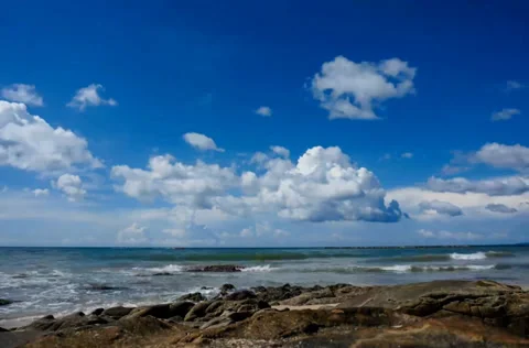 Timelapse of Moving White Cloud At Sea View During Blue Sky Stock Footage 38004816