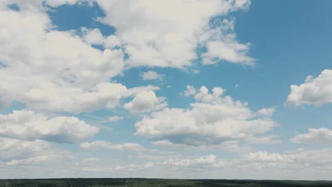 Timelapse of moving white clouds against a blue sky Stock Footage 320661150
