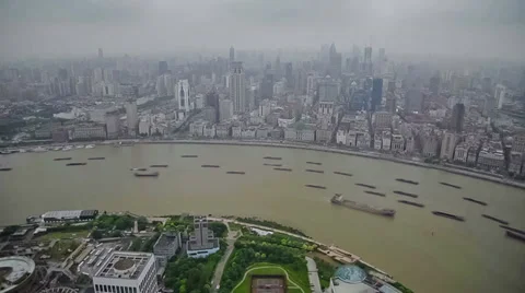 Timelapse of multiple barges sailing along river through Shanghai.  China Stock Footage 39046541