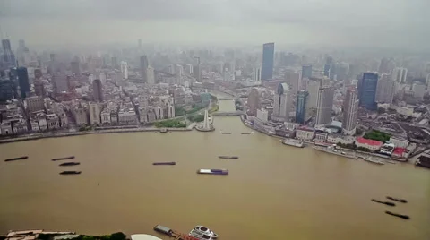 Timelapse of multiple barges sailing along river through Shanghai.  China Stock Footage 39164721