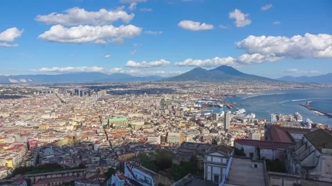 Timelapse of Naples panoramic cityscape showing vesuvius volcano looming ov.. Stock Footage 294675681