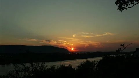 Timelapse of nature. The river against the background of the setting sun. 4k Stock Footage 157074280