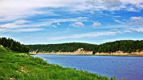 Timelapse of nature on a windy day. View of the river and the forest Stock Footage 72468354
