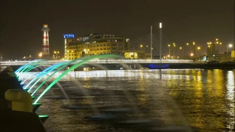 Timelapse at night of bridge lighthouse and a fountain Stock Footage 82744517