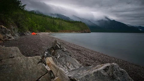 Timelapse of night camping and flame near pond Stock Footage 98740576
