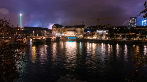 Timelapse of Night Cityscape in Basel with Reflections on the Rhine River Stock Footage 291736690