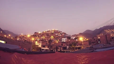 Timelapse of a night with clouds and moon, shows urbanized and illuminated hill. Stock Footage 147961870