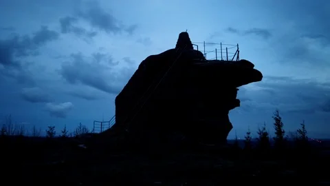 Timelapse night falling on a rock Stock Footage 106978039