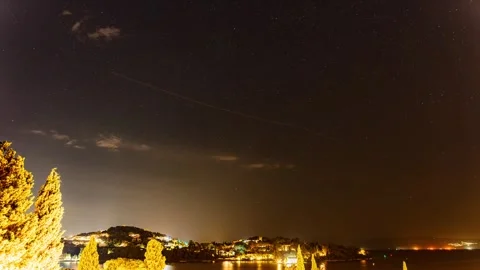 A timelapse of the night sky over the Bay of Gouvia on a summers night Stock Footage 313601759