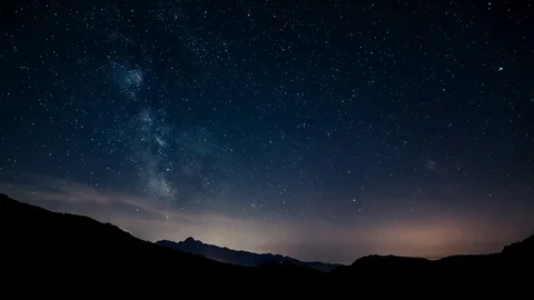 Timelapse night sky stars milky way on mountains background. Tuscany Stock Footage