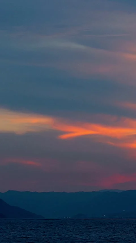Timelapse night view sunset sequentially coloring clouds over Miyajima,Verti,01 스톡 동영상 347597123