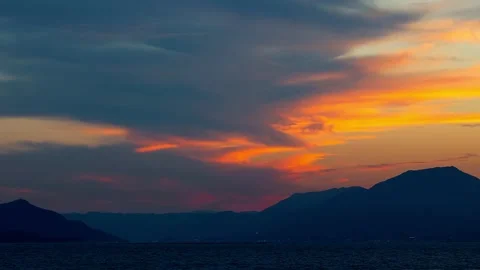 Timelapse night view sunset sequentially coloring clouds over Miyajima,4K Stockbeeldmateriaal 347597220