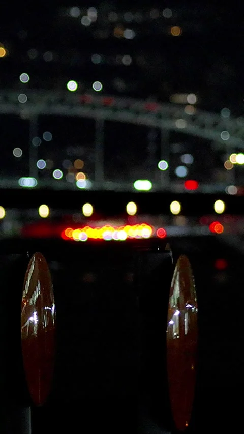 Timelapse Night View of Traffic on Arch Bridge with Orange Reflectors,Vertical Video stock 346079246