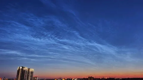 Timelapse of noctilucent clouds in the sky above the city 4k Stock Footage 237297413