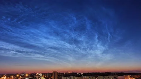 Timelapse of noctilucent clouds in the sky above the city 4k Stock Footage 237297435