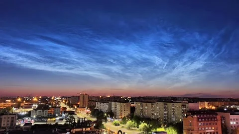 Timelapse of noctilucent clouds in the sky above the city 4k Stock Footage 237297485