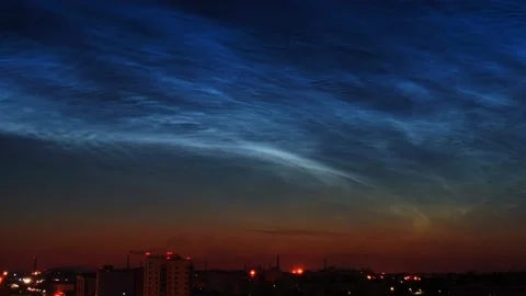 Timelapse of noctilucent clouds in the sky above the city 4k Stock Footage 237297494