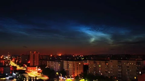 Timelapse of noctilucent clouds in the sky above the city 4k Stock Footage 237297531