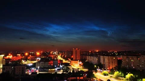 Timelapse of noctilucent clouds in the sky above the city 4k Stock Footage 237297568