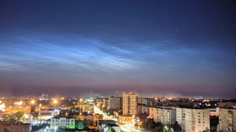 Timelapse of noctilucent clouds in the sky above the city 4k Stock Footage 237297611