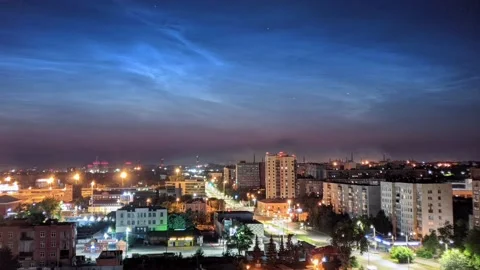 Timelapse of noctilucent clouds in the sky above the city 4k Stock Footage 237297622