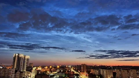 Timelapse of noctilucent clouds in the sky above the city 4k Stock Footage 237297628