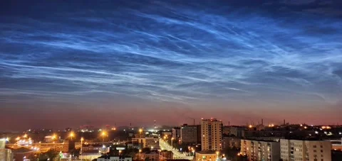 Timelapse of noctilucent clouds in the sky above the city 4k Stock Footage 237297693
