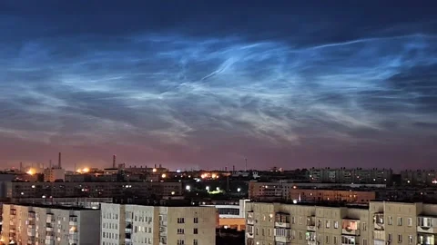 Timelapse of noctilucent clouds in the sky above the city 4k Stock Footage 237297700