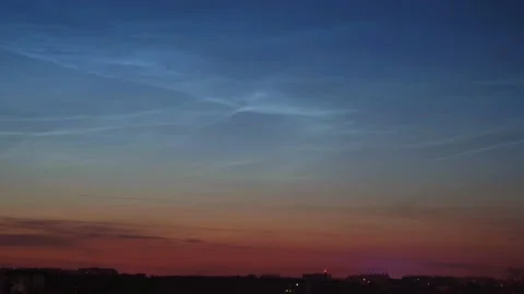 Timelapse of noctilucent clouds in the sky above the city 4k Stock Footage 237297828