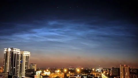 Timelapse of noctilucent clouds in the sky above the city 4k Stock Footage 237297830