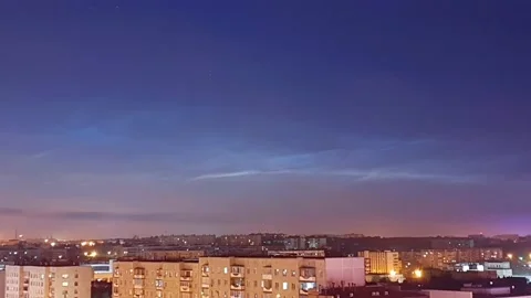 Timelapse of noctilucent clouds in the sky above the city 4k Stock Footage 237297916