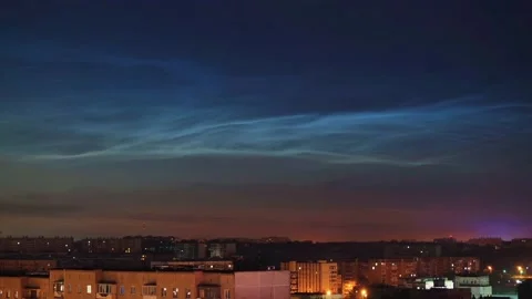 Timelapse of noctilucent clouds in the sky above the city 4k Stock Footage 237297947