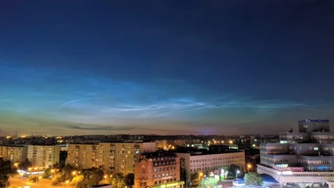 Timelapse of noctilucent clouds in the sky above the city 4k Stock Footage 237297952