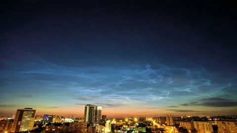 Timelapse of noctilucent clouds in the sky above the city 4k Stock Footage 237298017