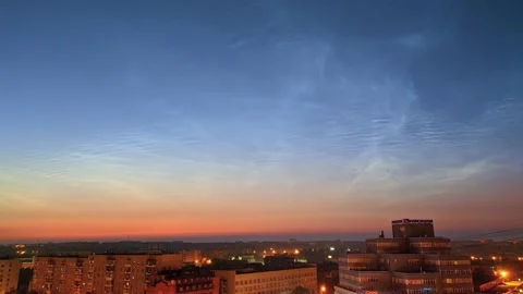 Timelapse of noctilucent clouds in the sky above the city 4k Stock Footage 237298029