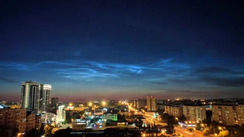 Timelapse of noctilucent clouds in the sky above the city 4k Stock Footage 237298052