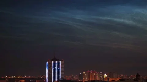 Timelapse of noctilucent clouds in the sky above the city 4k Stock Footage 237298089