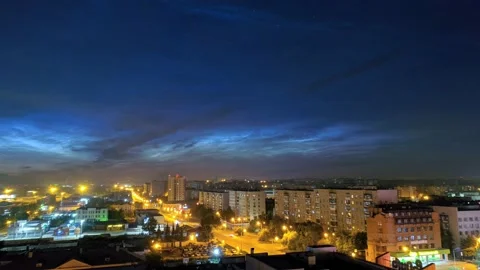 Timelapse of noctilucent clouds in the sky above the city 4k Stock Footage 237298170