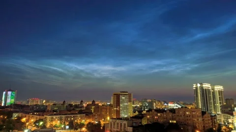 Timelapse of noctilucent clouds in the sky above the city 4k Stock Footage 237298171