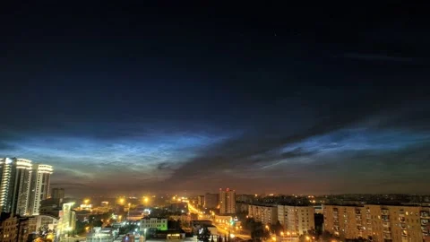 Timelapse of noctilucent clouds in the sky above the city 4k Stock Footage 237298172