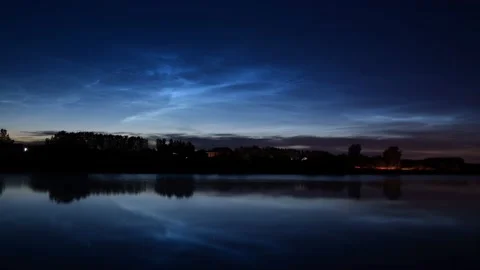 Timelapse of noctilucent clouds in the sky above the city 4k Stock Footage 237298531
