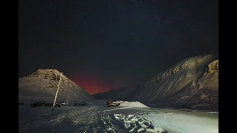 Timelapse of northern lights appearing in night sky over Longyearbyen, Svalbard Stock Footage 301556837